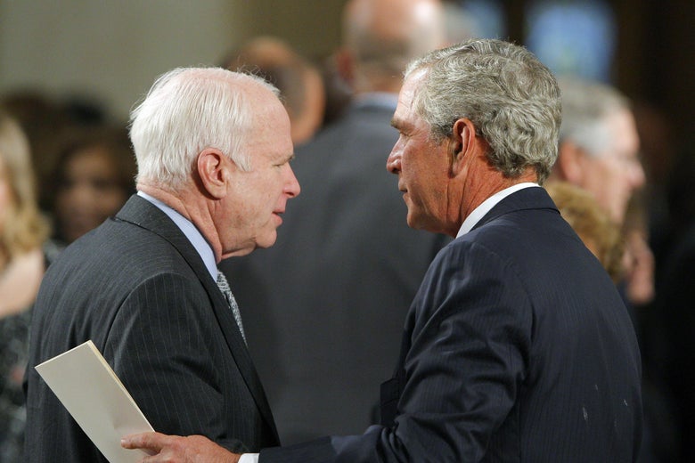 Senator John McCain talks with former US President George W. Bush as they await the start of the funeral services for Senator Edward Kennedy at the Basilica of Our Lady of Perpetual Help in Boston, on August 29, 2009.